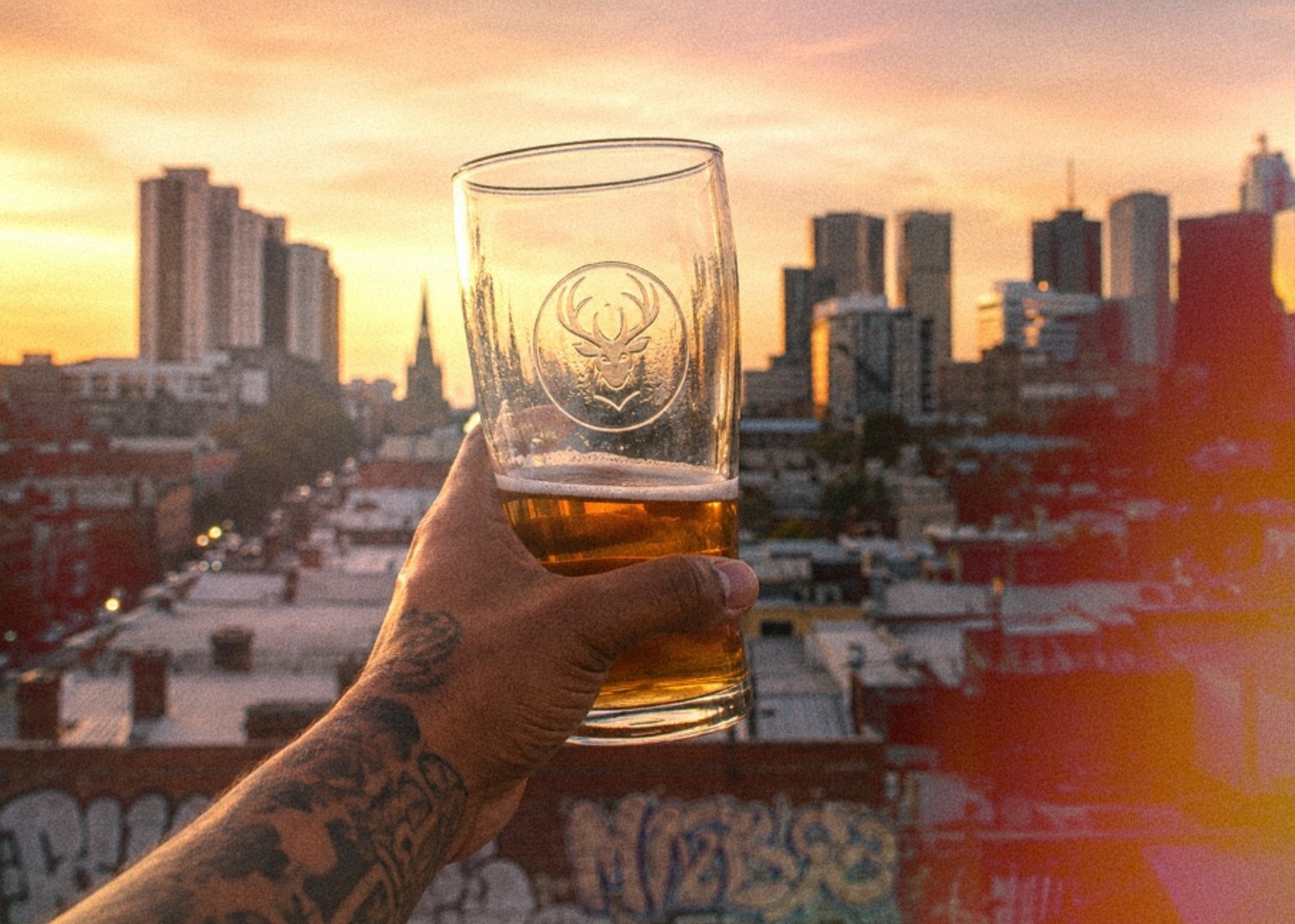 My Ultimate Bucks beer with the Melbourne skyline at sunset