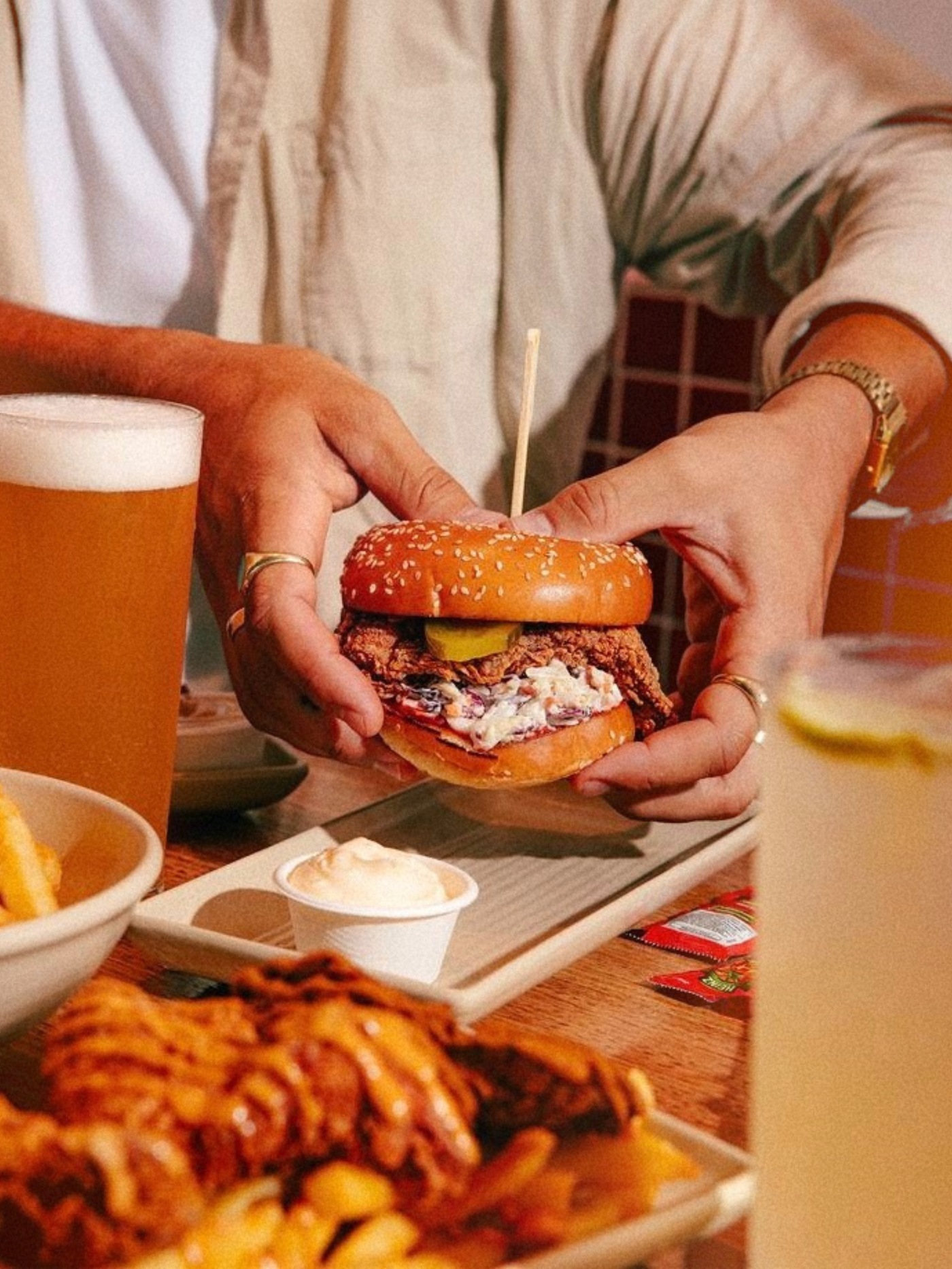Mates having burgers and beers on a bucks party