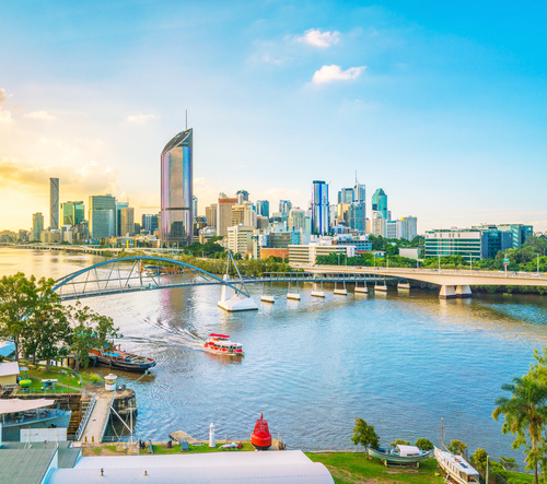 The Brisbane River and the city skyline, boats out on the water