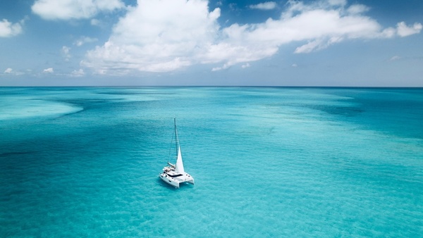 A yacht anchored in turquoise water
