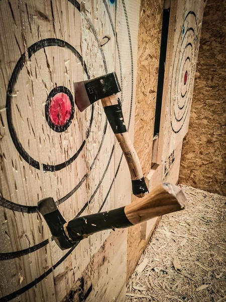 Axes stuck in a wooden throwing target
