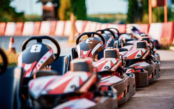 Go-karts lined up in the pit lane
