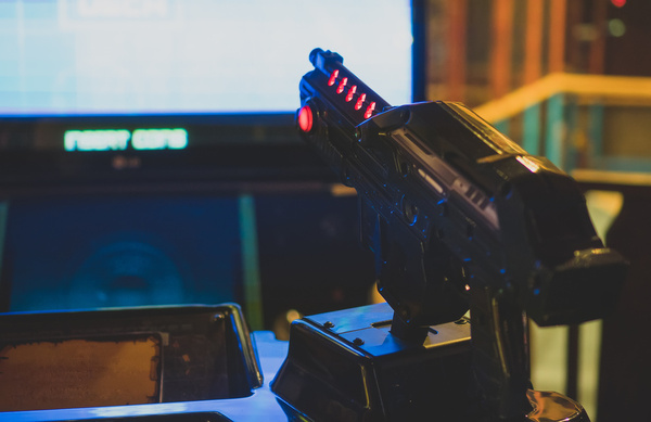 A mounted gun on an arcade shooting game