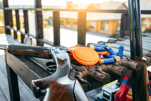 A clay trap machine loaded with orange clays