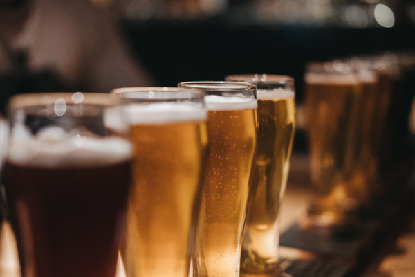 A row of beers lined up on the bar