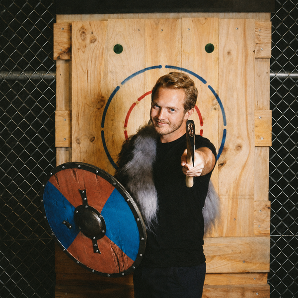 A bloke in a fur cape with a Viking shield, axe raised