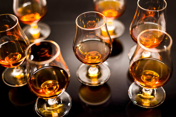 Glasses of whisky lined up for a tasting