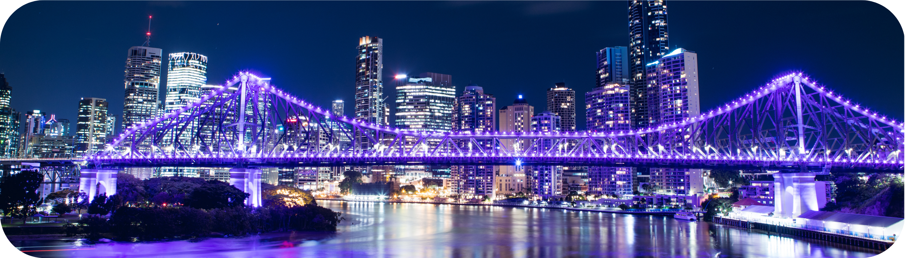 Brisbane at night with the Brisbane River and CBD lights reflecting on the water, showing the Storey Bridge and the fact Brisbane is an excellent choice for a bucks party destination